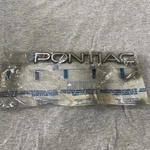Pontiac Emblem Genuine Gm 22543680 Nos Name Plate. Fixed Price $20.00.