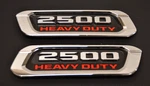 2X Oem Ram 2500 Heavy Duty Emblem Left & Right Side Badge Hood Chrome Red Set. Fixed Price $54.00.