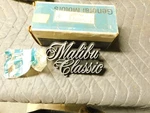 Nos Gm 1977 Malibu Classic Grille Emblem Ornament Part # 377075. Fixed Price $59.00.