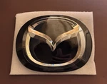 Oem Mazda CX-5 CX-9 Front Grille Emblem Radar Badge TK79-51-730. Fixed Price $175.00.