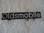 Oldsmobile Grille Emblem Metal Nameplate Ornament Script Trim 22524390. Fixed Price $48.00.