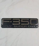 1999-2004 Ford "F-350 Xlt Super Duty" Plastic Fender Emblem F81B-16B114-CA. Fixed Price $13.99.
