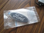 Oem Ford XF2Z-1642528-CB Rear Gate Emblem License Lamp Shield Windstar 99-03. Fixed Price $21.00.