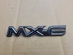 Mazda Oem 1993-1997 MX-6 Rear Emblem Badge Logo GA2A 51 720. Fixed Price $10.99.
