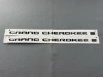 Genuine Mopar Grand Cherokee Nameplate Left 68524489AA Black Set Of Used Oem. Fixed Price $125.00.