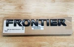 New 2018-2019 Nissan Frontier Black Tailgate Nameplate, Oem. Fixed Price $59.95.