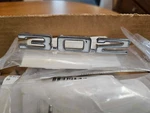 1968 "302" Camaro Right Side Fender Emblem, Nos. Gm #3927482. Fixed Price $43.00.
