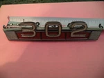 1968-71 Ford 302 Emblem Oem. Fixed Price $32.00.