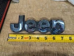 "jeep" Emblem - 7 1/4" Preowned Oem WD56TRMAA. Fixed Price $19.00.