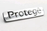 1995-1998 Mazda Protege Rear Lid Chrome Emblem Logo Badge Sign Symbol Letters. Fixed Price $24.99.
