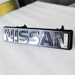Nos Oem Nissan Maxima Grille Emblem 62390-15E00 1985 1986 Front. Fixed Price $59.99.