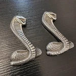 Vintage Ford Cobra Snake Emblems Pair C90B-6340318-D Oem New. Fixed Price $89.95.