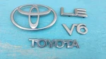 92-94 Toyota Camry V6 Back Door 75441-06010 Emblem 75447-33010 Nameplate Set. Fixed Price $22.99.