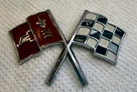 Original 1964 Chevy Corvette Crossed Flag Emblem 3872929 - 66. Fixed Price $25.00.