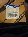 Genuine Mopar Front Door Nameplate Left 68366997AB. Fixed Price $65.00.