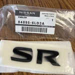 Genuine Nissan Emblem Trunk Lid "sr" Nameplate 84895-6LD3A. Fixed Price $79.99.