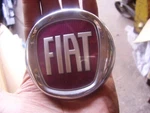 Fiat Burgundy/chrome Badge D519 Grille/bumper. Fixed Price $40.40.