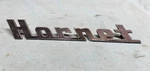 1954 Hudson Hornet Emblem Nameplate Script Oem Part #241171 (l?). Fixed Price $39.99.