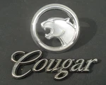 Vintage Ford Cougar Emblem E10B-8B343-AB + Cursive LOGO...1 Lot. Fixed Price $57.50.