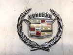 1980 - 93 Cadillac Eldorado Chrome Trunk Lock Cover Slider W/wreath 20336943. Fixed Price $108.00.