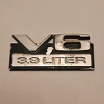 1987-1990 Dodge Dakota "V6 3.9 Liter" Fender Emblem P/n 4357096 As Removed. Fixed Price $9.99.