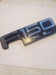 97-03 Ford F150 Fender Emblem Nameplate P# XL34-16B114-BA One Pin Broken Oem. Fixed Price $17.95.