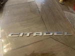 Mopar 68087333AB "citadel" Chrome Door/hatch Emblem. Fixed Price $50.00.