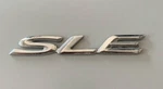 99-03 Toyota Solara Sle Rear Trunk Emblem 75443-06100 Used Oem. Fixed Price $9.00.