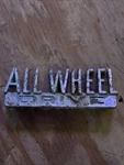 Vintage Original International Scout All Wheel Drive Emblem Badge 184338-RI. Fixed Price $20.00.