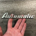 Studebaker Commander Automatic Drive Emblem 1951 - 1953 Roth 296444, 296445. Fixed Price $29.99.
