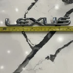 1990-05 Chrome Lexus Emblem Badge Logo Nameplate 7.5 In. Peel & Stick Adhesive. Fixed Price $23.00.