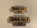 Pair (2) Nos Volvo Fender Emblems 240 2.3 Rare 1246373. Fixed Price $100.00.