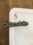 Oldsmobile Gm #22522196 559183 Radiator Grille Name Plate. Fixed Price $50.00.