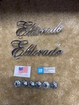 New Cadillac Eldorado Quarter Panel Emblems PART#1701943 1975 1976 Pair. Fixed Price $110.00.