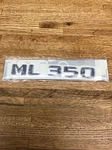 Mercedes Benz ML350 Oem Factory Brand New Rear Gate Emblem Part # A1648171215. Fixed Price $42.00.