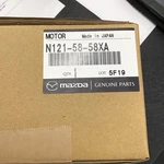 Genuine Mazda Window Motor N121-58-58XA. Fixed Price $100.00.