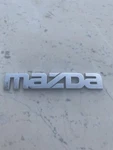 Mazda Nameplate Emblem Chrome Letter Badge GA2K 51 711 Oem Used. Fixed Price $15.00.