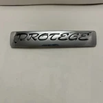 Mazda Oem Protege Rear Trunk Emblem Badge Logo Nameplate BR72 51 721, Mid 90 S. Fixed Price $19.95.