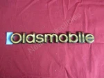 Nos Oem Oldsmobile Silhouette Apv Rear Panel Nameplate Emblem 1998 - Gold. Fixed Price $19.99.