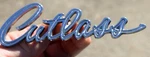 1960S Oldsmobile Cutlass Chrome Script Emblem Pt# 8727372. Fixed Price $39.99.