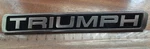 Triumph Metal Badge - Part Number 88627252. Fixed Price $13.44.