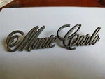 1970-1971 Chevrolet Monte Carlo Rear Panel Script Emblem Nameplate 801904 Gm. Fixed Price $45.00.