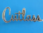 1964 Oldsmobile Cutlass Metal Fender Emblem Factory Oem# 588724 R.h. W/mounts. Fixed Price $125.00.