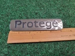 1999-2001 Mazda Protege Emblem Rear Lid Trunk Badge Logo Symbol Chrome Oem 2M4. Fixed Price $12.99.