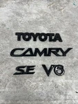 2002-2006 Toyota Camry V6 Tailgate Nameplate Emblem Logo Set Black Oem. Fixed Price $28.45.