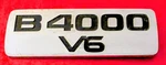 Mazda B4000 V6 Fender Emblem Chrome Nameplate (scratches) Adhesive Included. Fixed Price $15.49.