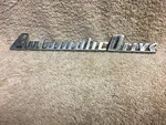 Studebaker Roth 296444, 296445 1951 1952 1953 Commander Automatic Drive Emblem. Fixed Price $145.00.