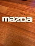 Mazda Oem White Plastic Emblem Badge Logo. Fixed Price $17.99.