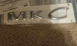Genuine Ford Name Plate EJ7Z-1642528-A. Fixed Price $16.00.