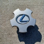 Lexus ES300 Center Cap, Silver Emblem, 1992-1997, P/n 8114 01. Fixed Price $12.95.